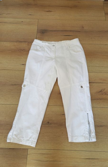Białe bawełniane spodnie z zamkami i kieszeniami, rozmiar 38