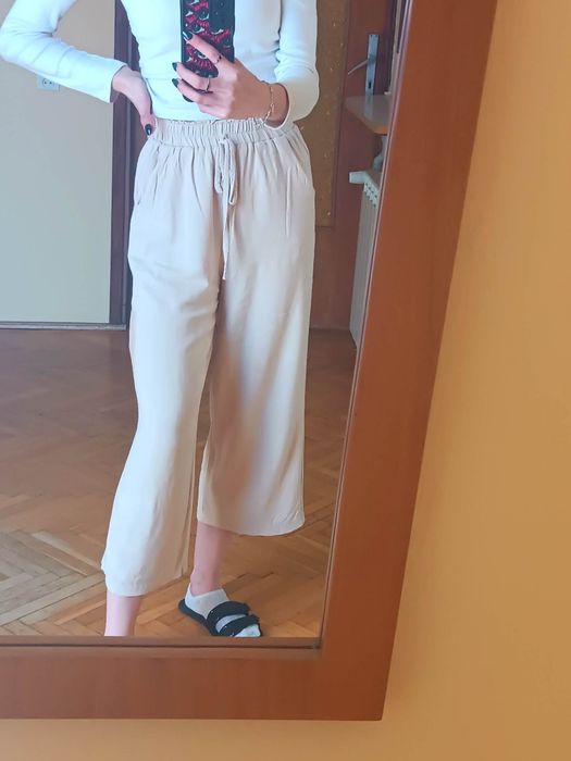 Lniane beżowe spodnie 3/4 7/8 na gumce luźne proste nogawki / XXS 32
