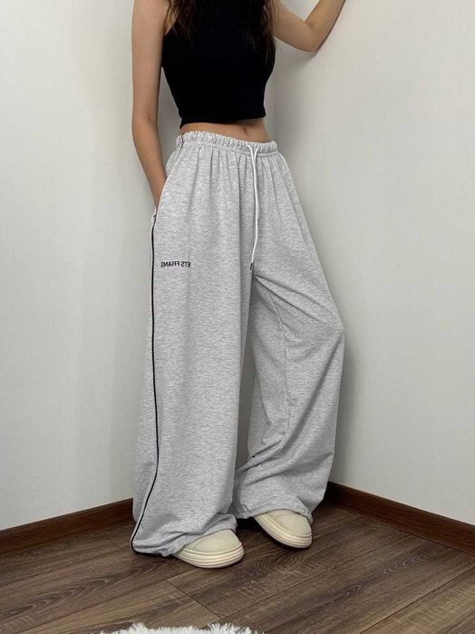 Жіночі весняні штани супер оверсайз широкі вільні с затяжками знизу