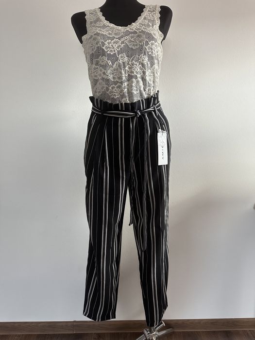 Spodnie zwiewne wiązanie kokardka pionowe paski czarne kuloty na lato