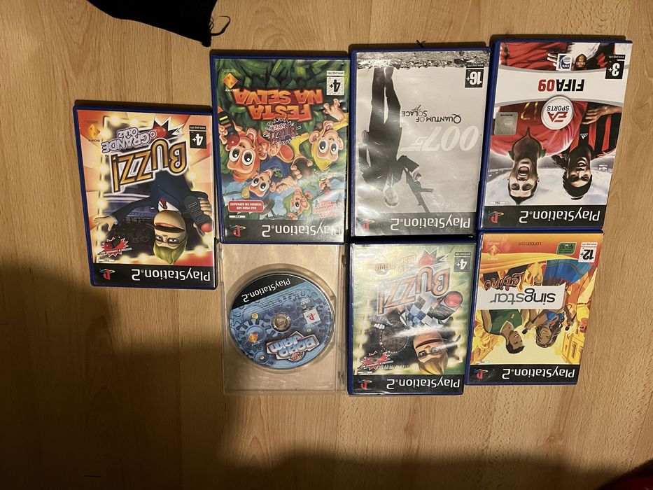 PS2 with controllers, games, and microphone for SingStar Latino64172206791810124