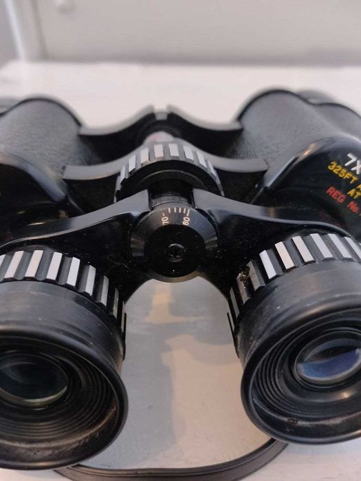 Японский бинокль Tasco 7-15х35 Zoom. Надійна техніка