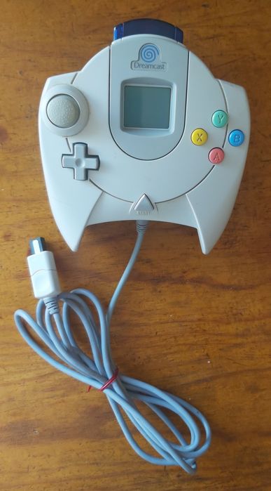 Dreamcast controller + VMU and controller vibration pack.64738122461569121
