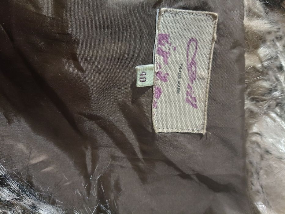 Жіноча, хутряна желетка . Розмір 40.