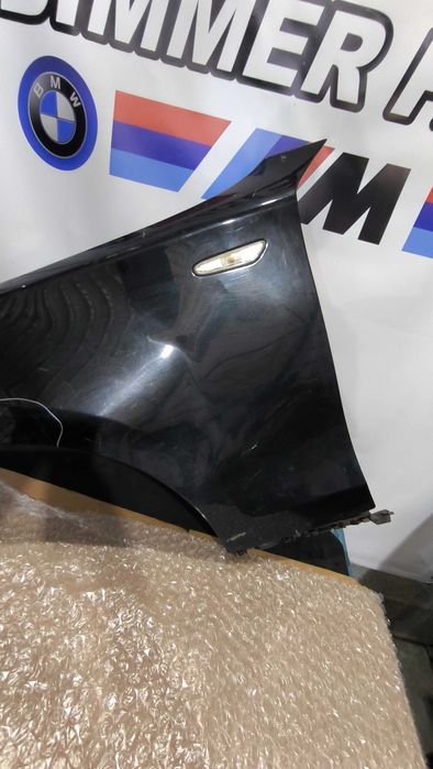 Guarda Lamas BMW (E81/E82/E87/E88) Esquerdo (Com defeito)