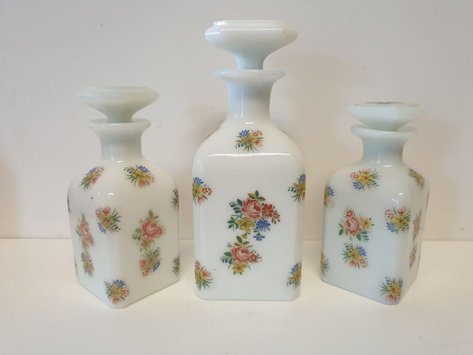 3 vintage perfume bottles in white opaline glass with floral decoration — signed