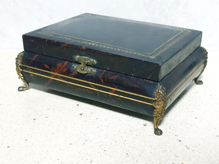 Beautiful antique jewelry box upholstered in embossed leather with bronze feet