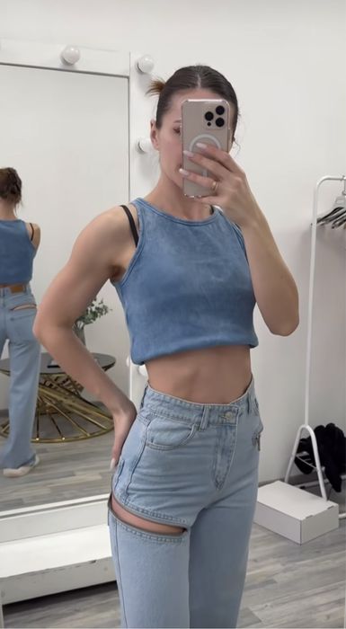 Джинси сині із замочками кльош труби дешево