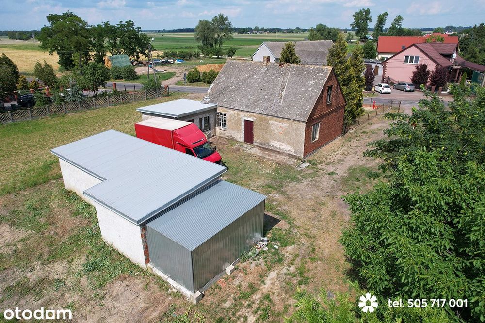 Dom z budynkiem gospodarczym i garażami