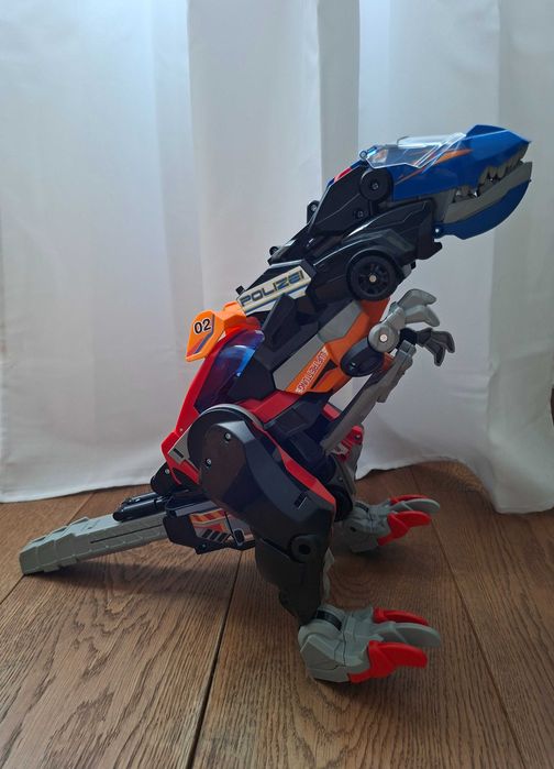 Dinozaur Transformer VTech Switch & Go Mega T-Rex 3w1 Niemiecki