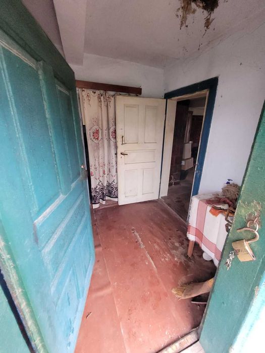 Дерев'яний будинок та земельна ділянка 14 сот. м. Кам'янка-Бузька