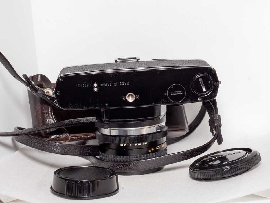 Olympus OM-1n + RMC Tokina 28mm 1:2.8 + bolsa (base)