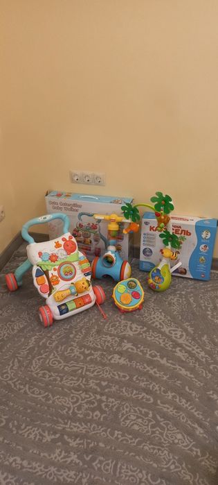 Толокар ходунці карусель мобіль на ліжечко музичний барабан каталка