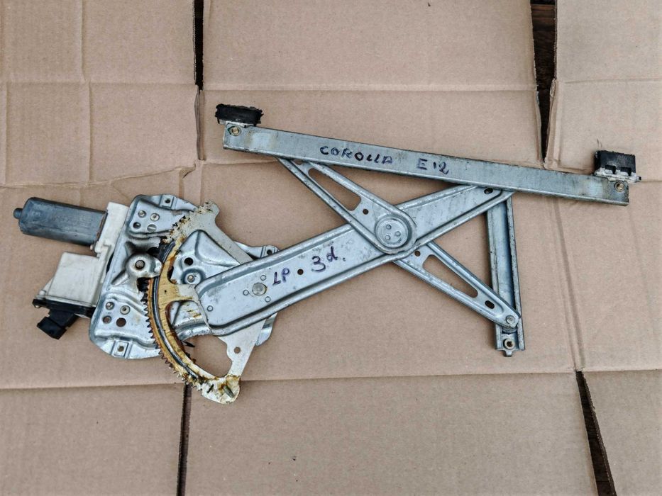 Corolla E12 3d HB mechanizm + silniczek szyby lewej lewy przód