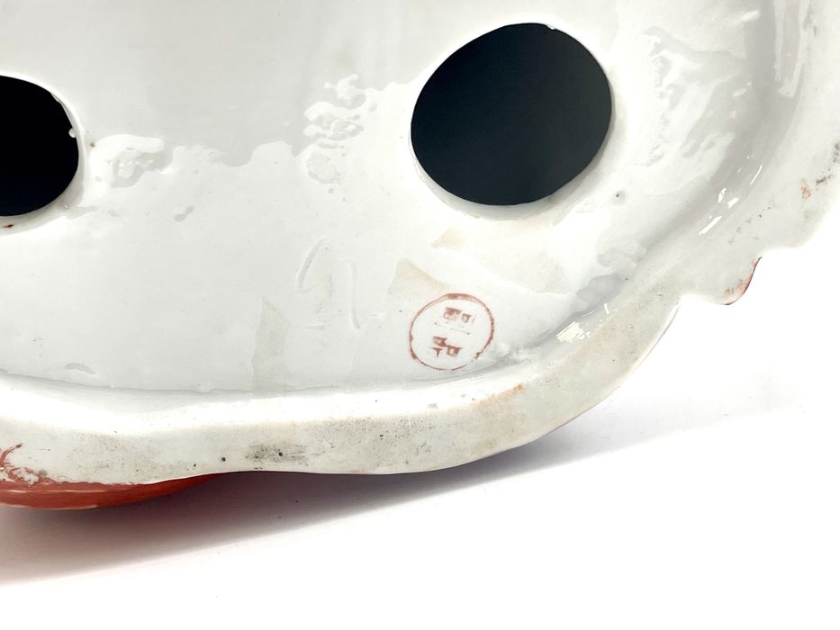 Buda em porcelana antigo