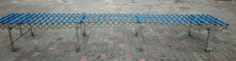 Podajnik rolkowy przenośnik teleskopowy transporter stół rolkowy