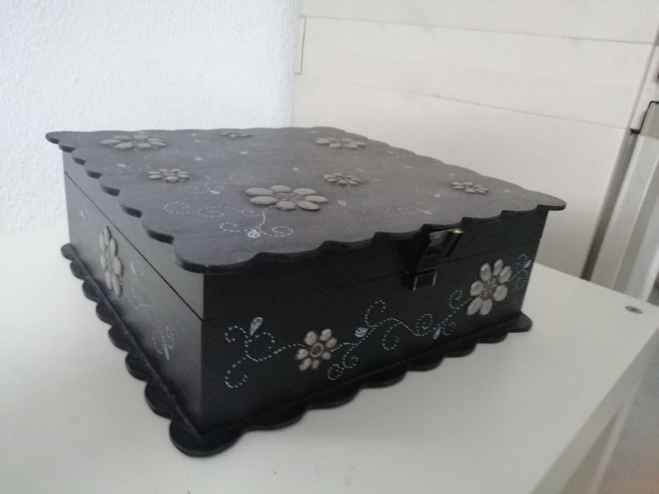 Wooden box with tin appliqués