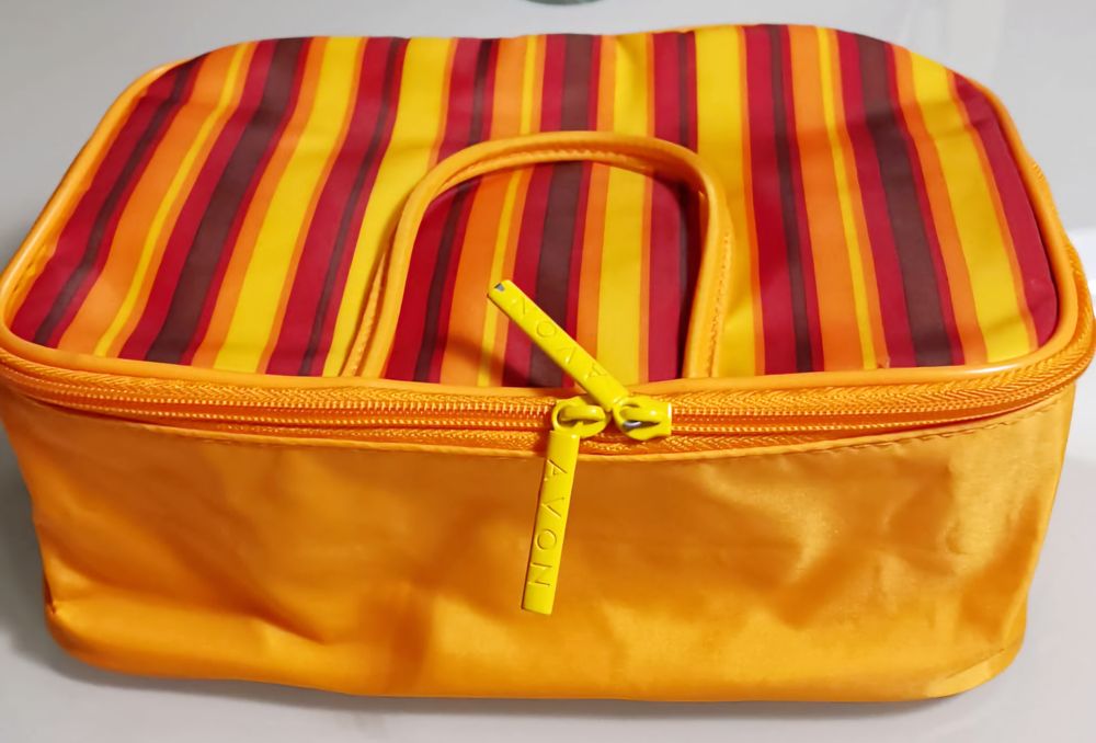 Pomarańczowa kosmetyczka podróżna w paseczki, Avon