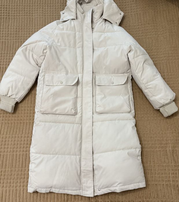 Пуховик в молочному кольорі