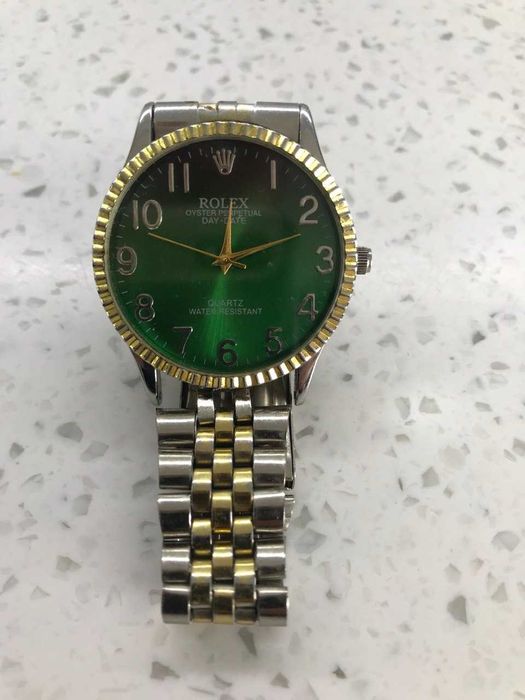 Rolex oyster perpetual day date quartz water resistant