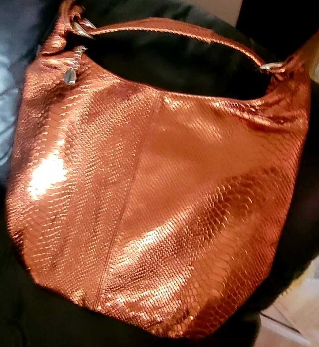 Miedziana,skorzana  torba-worek na.krótkim pasku