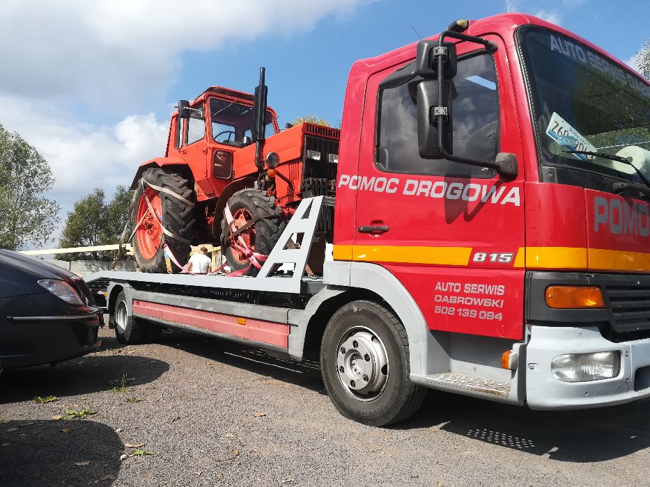 Transport maszyn rolniczych budowlanych laweta pomoc drogowa holowanie
