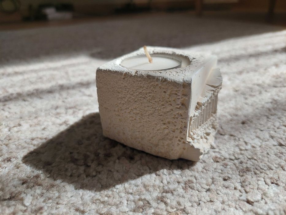 Vela com base em pedra