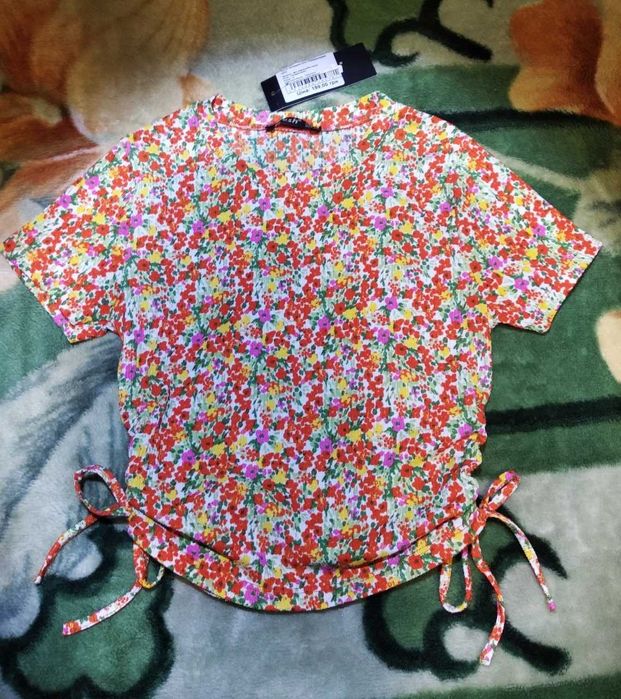 Футболка оранжевая в цветочек на девочку 140-146см