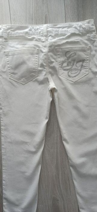 Białe z dżinsowego streczu rurki Guess. R 152 cm. Stan bardzo dobry.