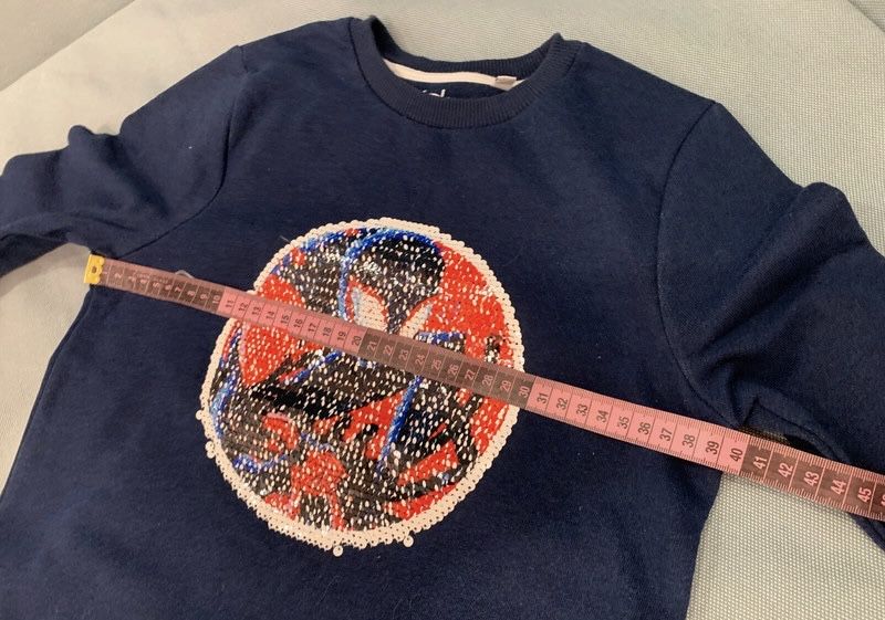 Granatowa bluza chłopięca cekiny Spiderman C&A 128/134