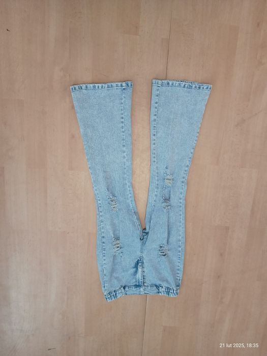 Spodnie dzwony z dziurami rozciągliwe dla dziewczynki rozm. 150