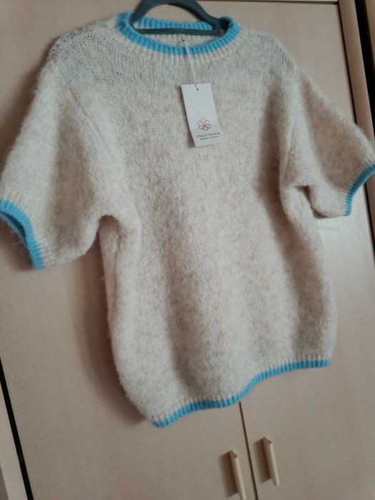 Nowy piękny  mięciutki Sweterek