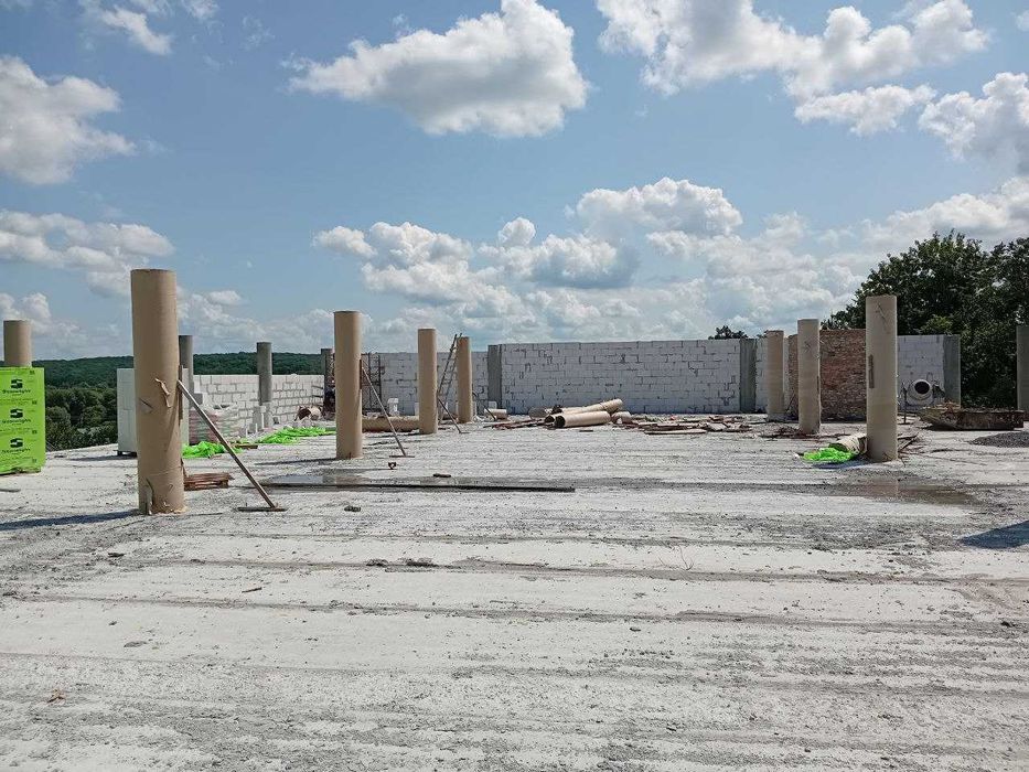 Заливка фундаменту плита стрічковий палі ростверк бетонні  будівництво