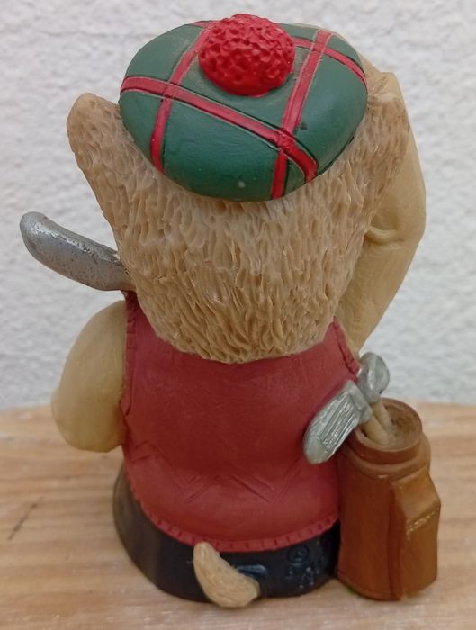 Estatueta de um cão golfista