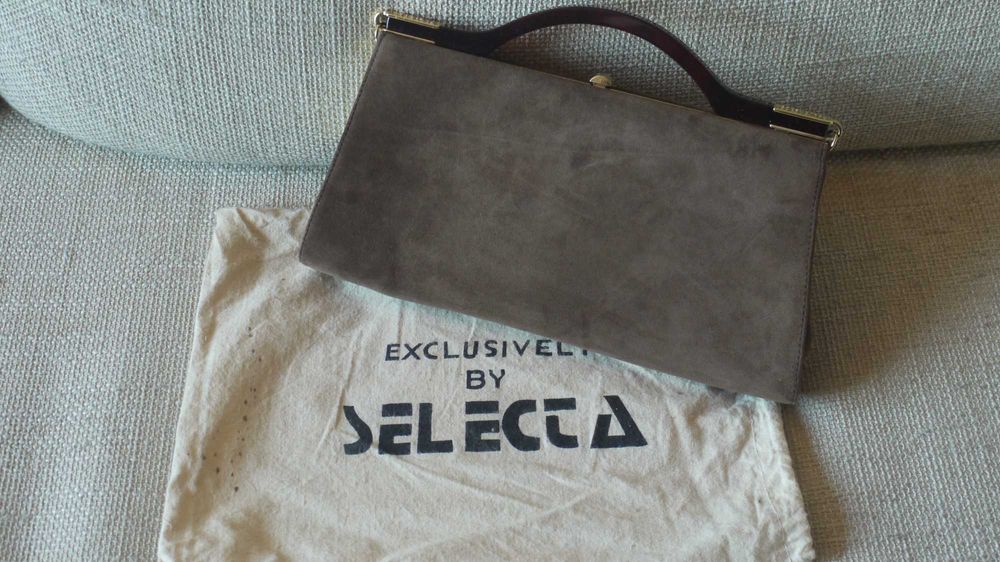 Mala de mão em pele genuina, com acabamento exterior em camurça