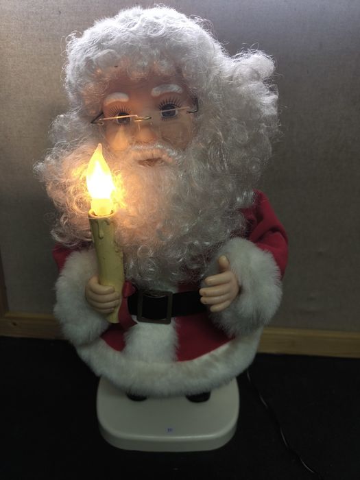 Pai Natal com Vela Luminosa e movimentos.
Figura decorativa de Pai Nat