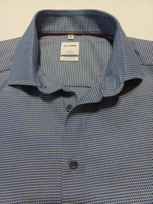 Męska koszula niebieska Olimp rozm 2XL.