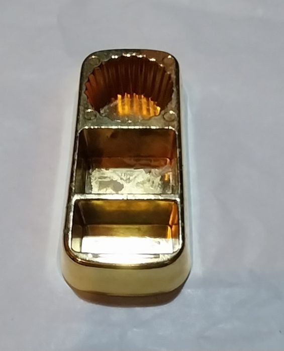 Abre cápsulas antigo em forma de barra de ouro