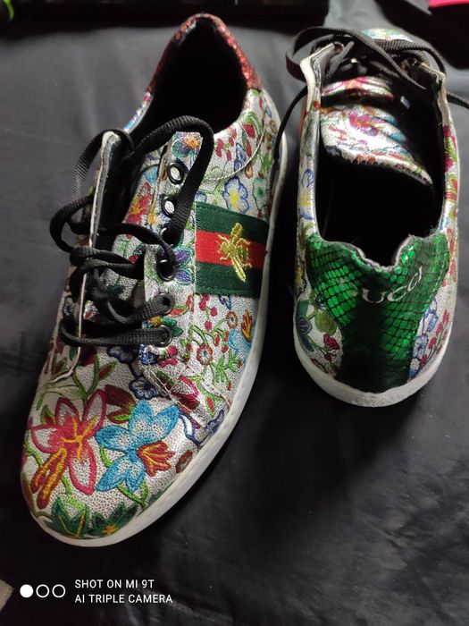 Кросівки Gucci Ace з квітковим принтом.