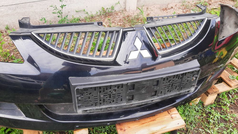 Mitsubishi Lancer VII 7 zderzak przedni kompletny spryski halogeny