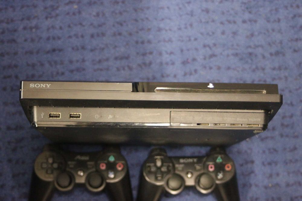 PlayStation 3 + Controllers + Power Cable + Controller Charger64729497874049123