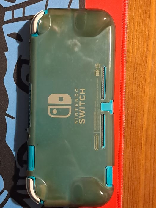 Nintendo Switch Lite + Extras