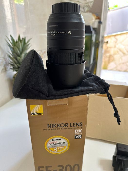Máquina fotográfica nikon mais objetiva