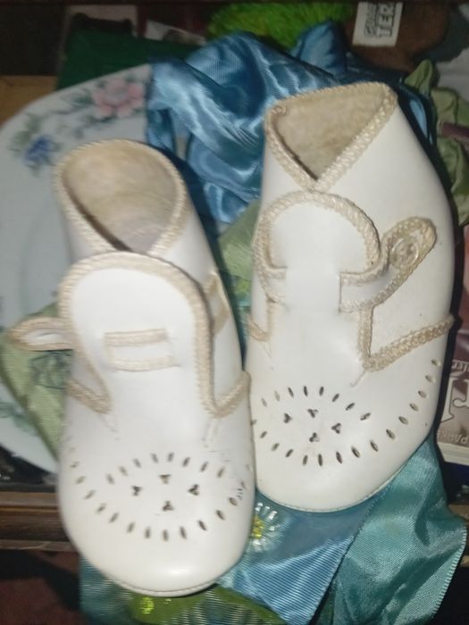 Sapatos de bebe boneco