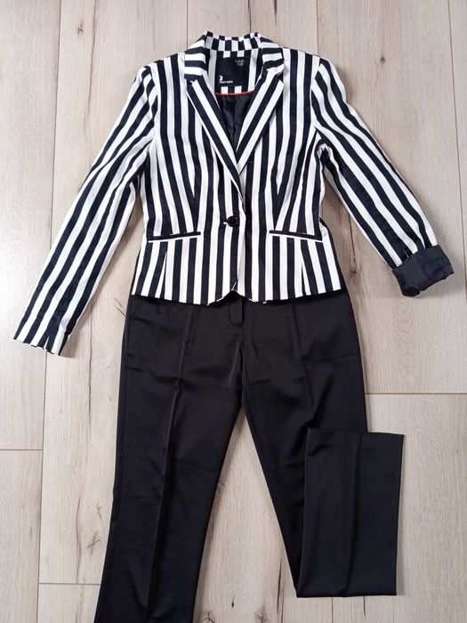 Nowe eleganckie damskie spodnie w kant RESERVED s/m