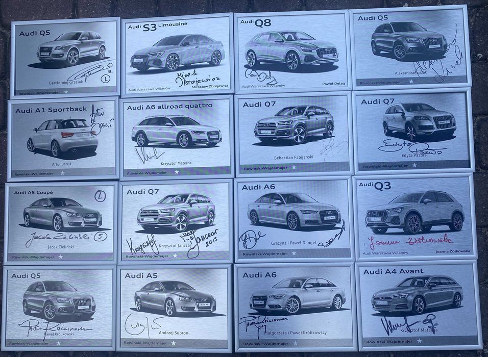 Tabliczki z autografami i modelami Audi