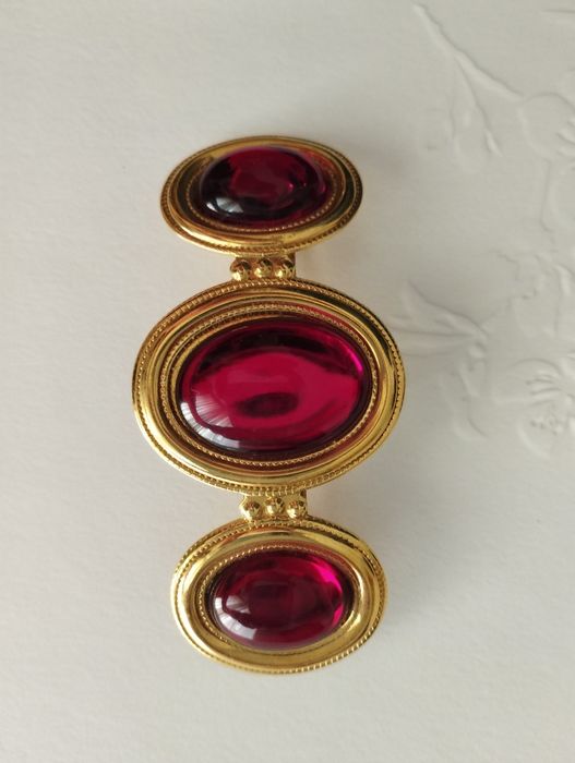 Conjunto de brincos e travessão