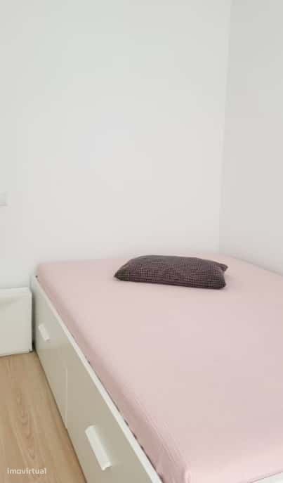 Superior room with shared bathroom and a sofa