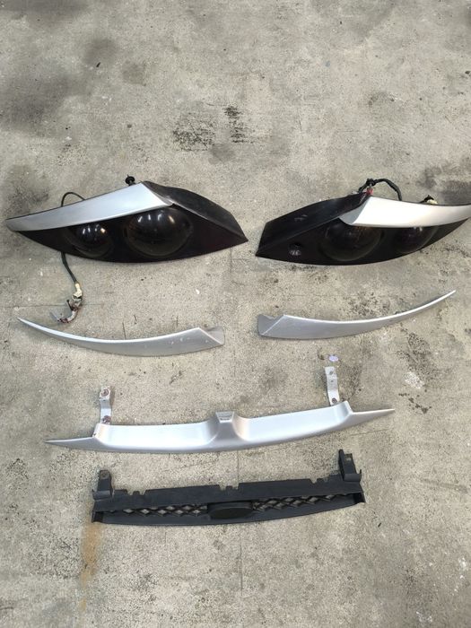 Ford Cougar Lampy Tył tylnie, dokładki lamp, grill atrapa przód