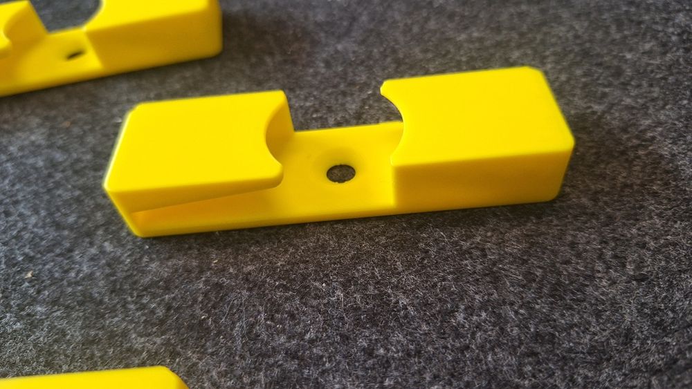 Suporte de parede para carreto de pesca